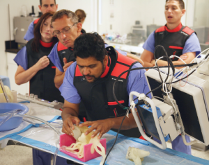 A surgeon holds a a medical model made from Agilus30